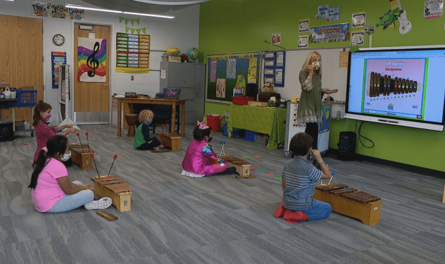 Image of Melody McGarrahan and her students playing with Quaver Music's Orff Library
