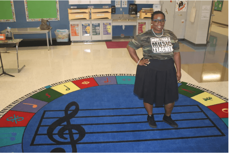 Image of Quaver teacher Alicia Engram standing in her music classroom