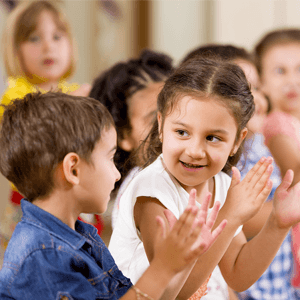 Kids clapping in classroom