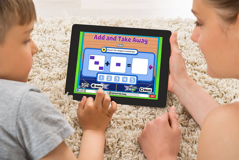 FullSize_ProgramFeatures_456826654 – QuaverEd Teacher or parent and student do a math activity on an ipad together