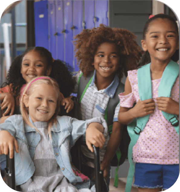 ThemeBlocks_grid_noText_Welcome2Prek – QuaverEd A picture of four young children smiling in the school hallway representing the theme Welcome to Pre-K from Quaver Pre-K