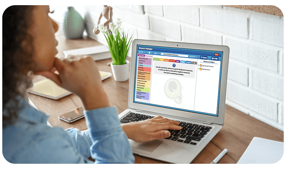 ResourceManager – QuaverEd Teacher using a laptop with Quaver Music Integration's Resource Manager.