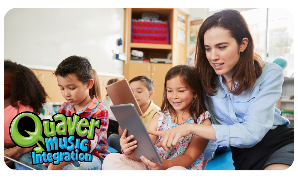 QuaverMusicIntegration_TeacherStudent – QuaverEd Female teacher helps female student on a tablet.