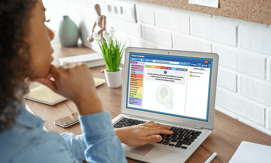 QuaverMusicIntegration_ TeacherCustomize – QuaverEd Teacher enjoying the resources of Quaver Music Integration on her laptop.