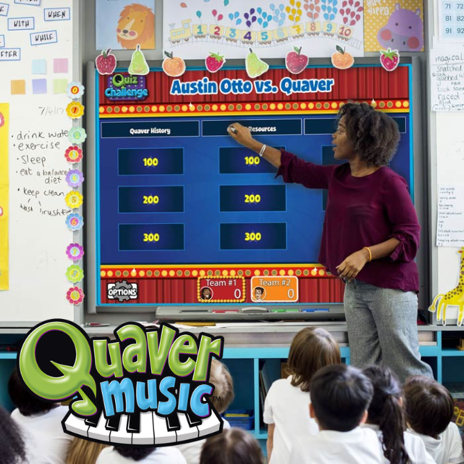 QuaverMusic_Product – QuaverEd An elementary school teacher using Quaver Music games on a smartboard to teach her students