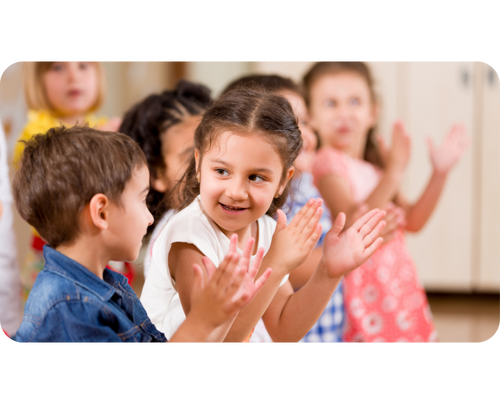Quaver Pre-K students clapping and smiling at each other