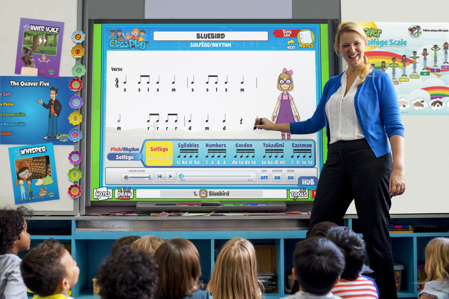 A smiling teacher using Quaver Music's Class Play on a smart board