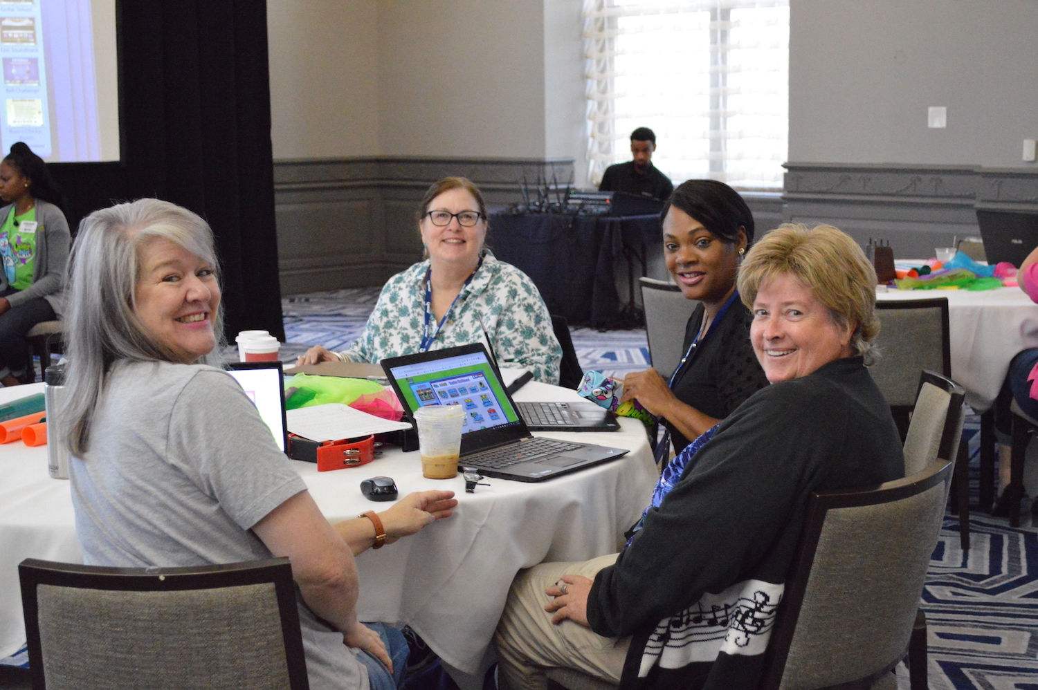 Quaver Ready teachers sitting at a table at a Quaver Ed training event