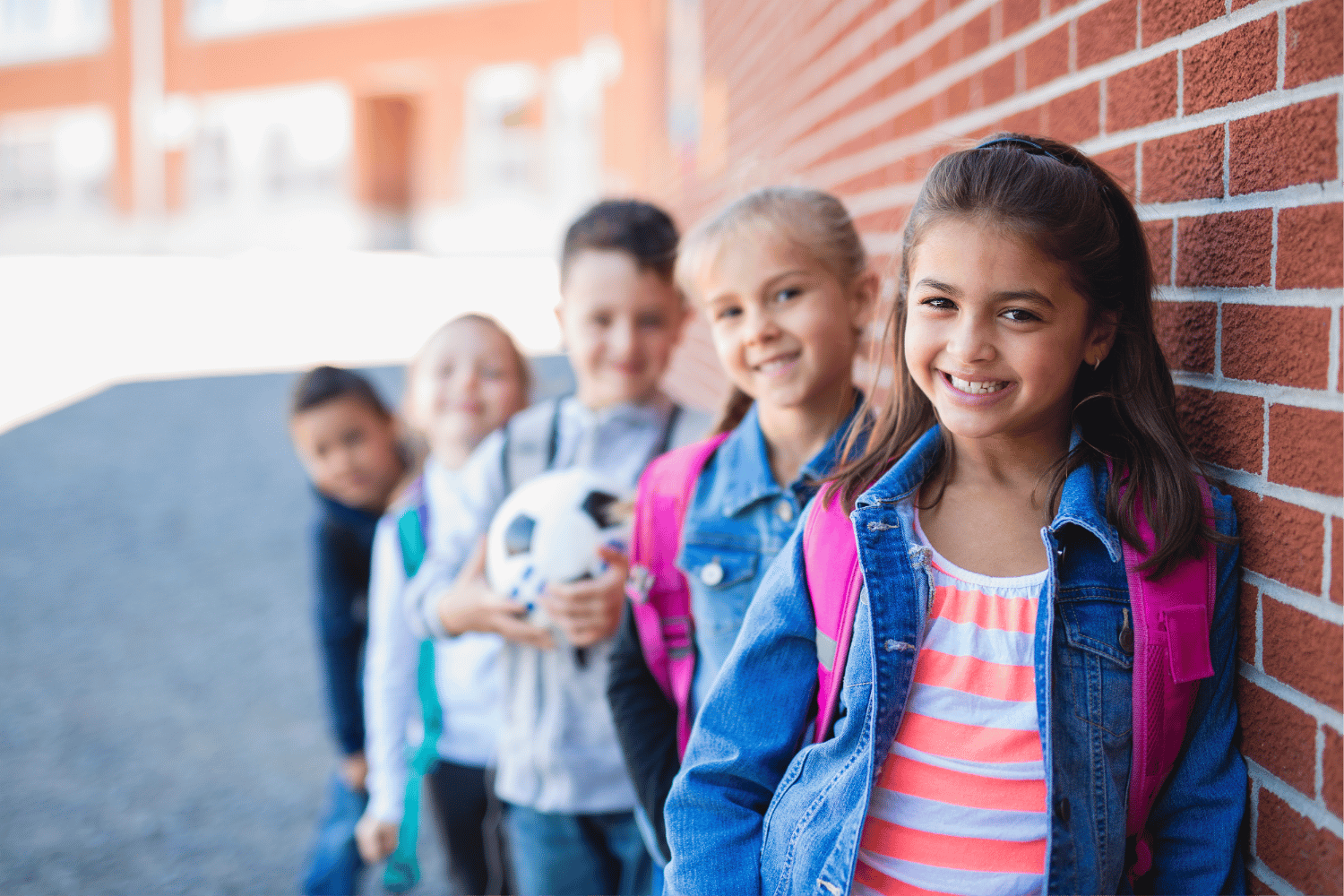 Students smiling outside school